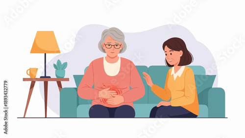 Caring woman comforts elder in pain, sitting on sofa
