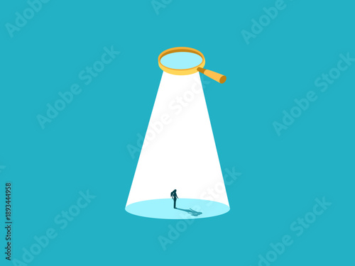 Analyzing businesswomen through magnifying glass.