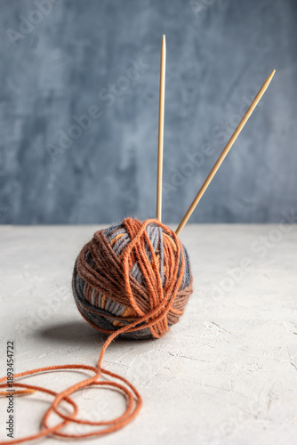 Multicolored yarn balls on a textured background