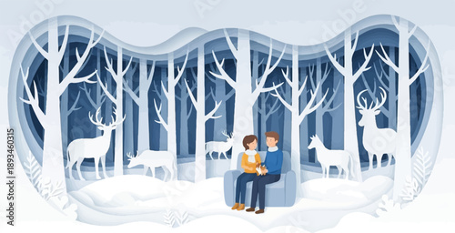Couple sitting on couch in a snowy forest with deer