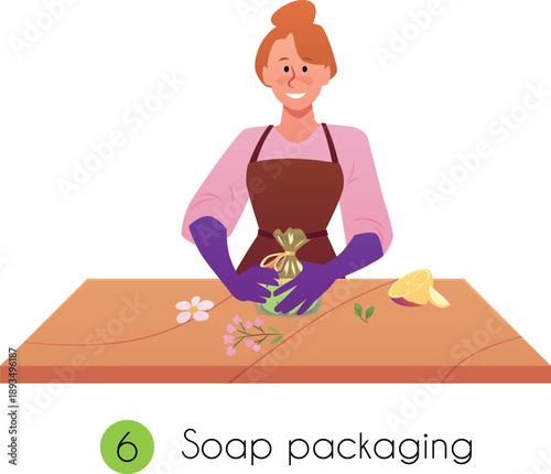 A woman in an apron and gloves at a table packaging handmade soap.
