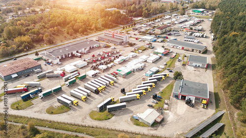 Schilderij op canvas Truck fleet parked at warehouse facility