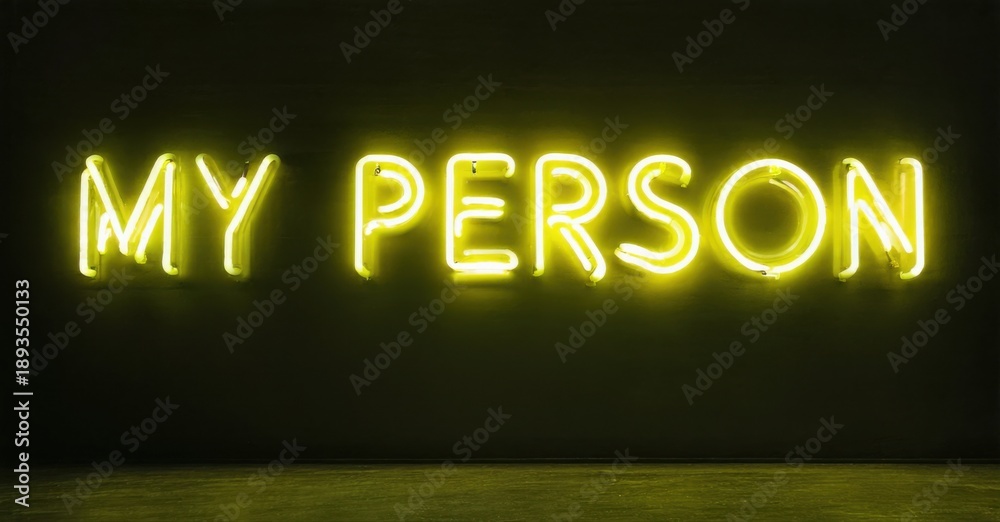 Fototapeta premium Bright neon sign displays text My Person against dark wall. Minimalist aesthetic, warm glow, simple composition. Focus on message.