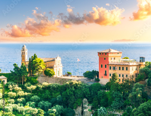 beautiful landscape of luxury resort Portofino in Luguria , Italy.  Sea coast of elite italian resort during sunset or sunrise. Beautiful bay with buildings and green mountain forest.