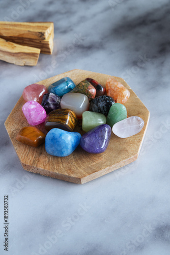 Colorful Healing Crystals Collection on Wooden Plate, Flat Lay