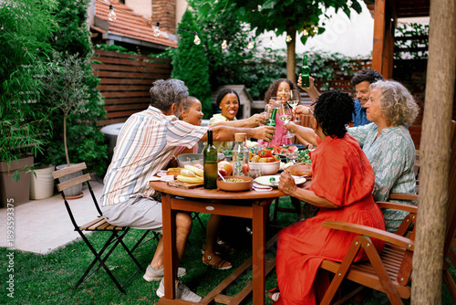 Canvas Print Family Making a Toast Together at Outdoor Dinner Party