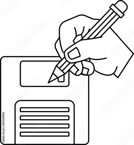 A hand is writing on a floppy disc