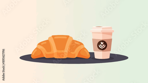 A golden croissant rests beside a to-go coffee cup on a dark surface