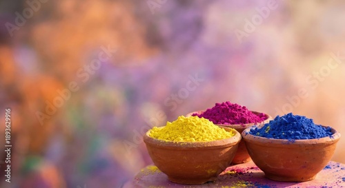 Vibrant Holi color powders in clay bowls