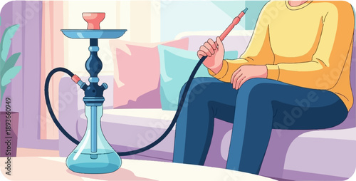 Person relaxes indoors, using a water pipe with a long hose while sitting on a couch