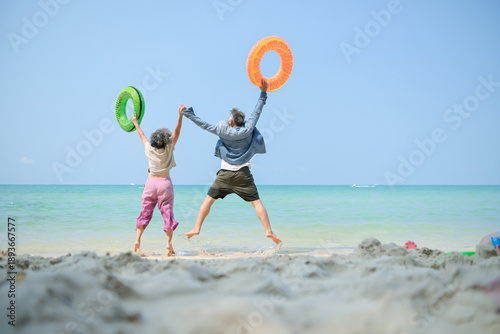 Wallpaper Mural In holiday, Senior couple holding hands while standing in shallow sea water Torontodigital.ca