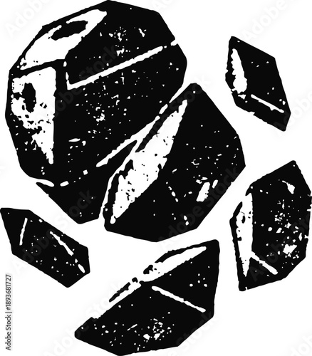 Collection of cracked black stones and rock fragments in rough shapes and textures