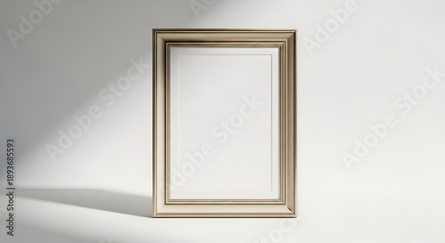 Luxury gold frame on white wall with elegant lighting