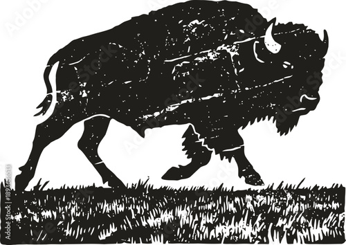 Black silhouette of a buffalo walking on grassy ground with textured vintage