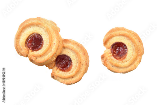 Butter cookies with jam closed up view above isolated on white