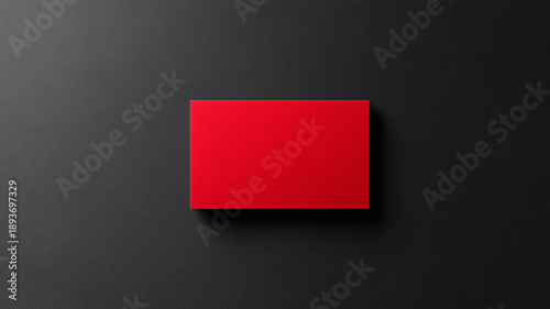 red business card mockup on a black background.