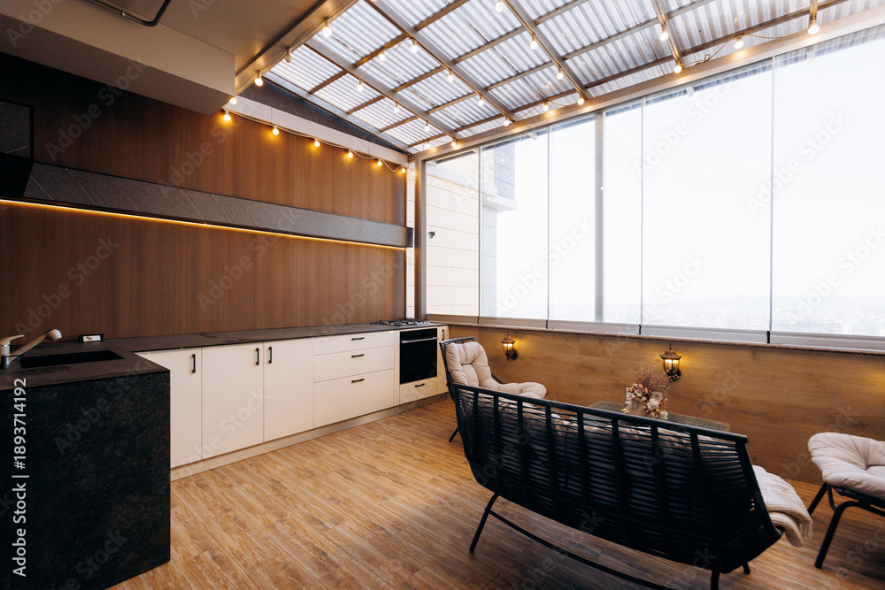 Naklejka premium Elevated sundrenched lounge with panoramic views and modern decor