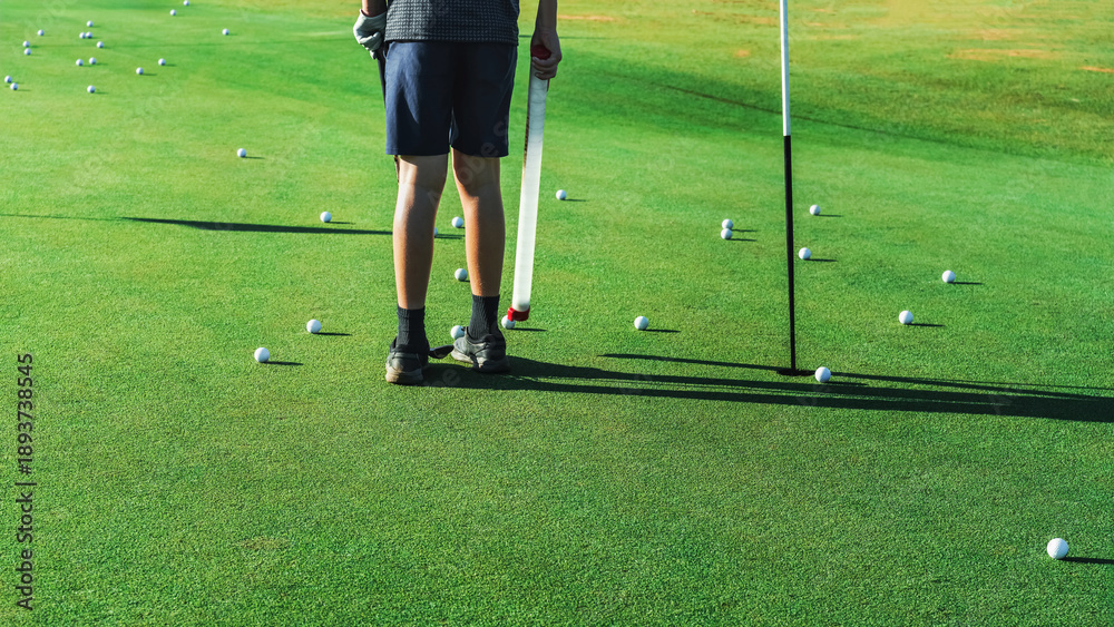 Obraz premium Golf practice session on a luxury course with many balls scattered on the green