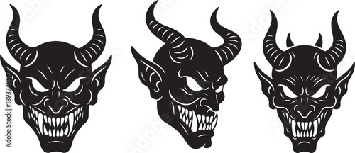 Three spooky black monster demon faces with sharp teeth and horns, glowing eyes, a scary halloween evil creature design