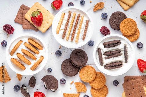 Set of different trendy yogurt and cookie dessert. Simple two ingredient japanese yogurt cheesecake, viral tasty quick recipe made with greek yogurt, various biscuits and berries