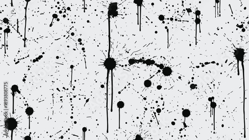 Black ink splatters and drips on white background creating abstract artistic texture with varied splatter sizes and dynamic patterns