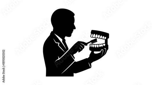 Dentist Holding Human Tooth Model and Toothbrush