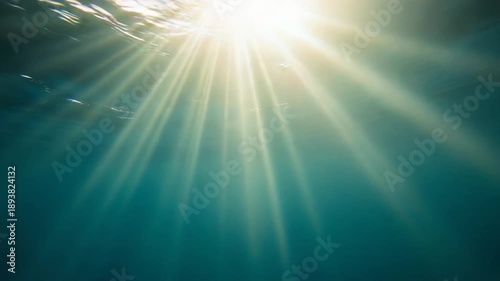 Video A sunny day at a body of water with sunlight shining down and reflecting off the surface