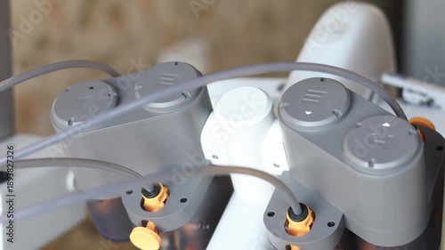 Close-up of precision mechanical parts inside a 3D printer. Concept of engineering accuracy, industrial machinery, and high-tech equipment.