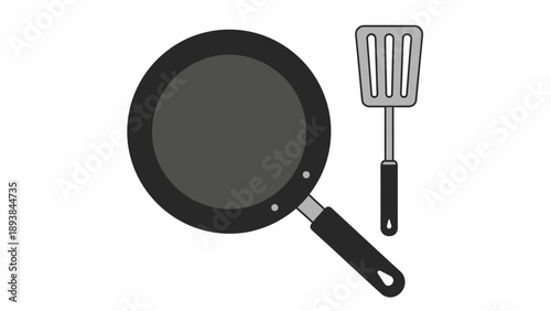 Frying pan and metal spatula.