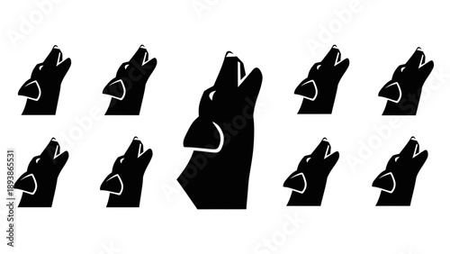 Black silhouette of multiple dog heads.