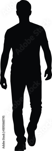Silhouette of a man walking alone on a in a relaxed pose