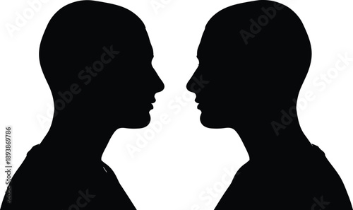 Silhouette of two human heads facing each other in profile view, symbolizing communication, confrontation, or relationship dynamics