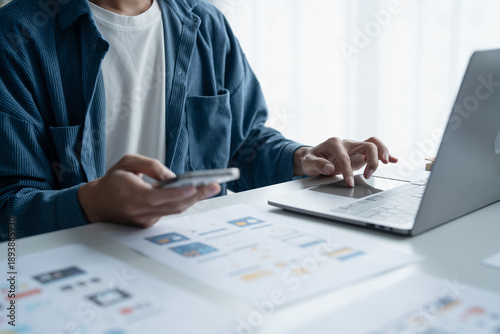 Tableau sur toile UX UI Designer Planning innovative Mobile App with Paper Wireframe Designs at Workspace