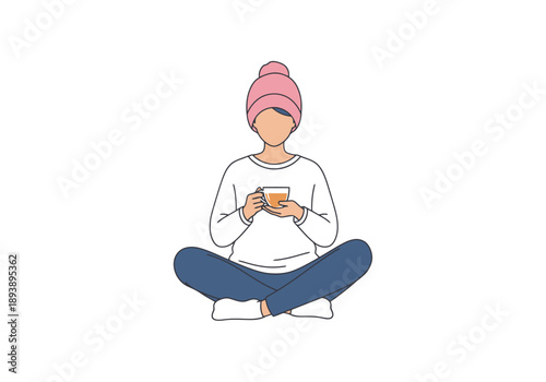 Person wearing knit cap and sweater sitting cross legged holding warm beverage casual comfort and relaxation concept