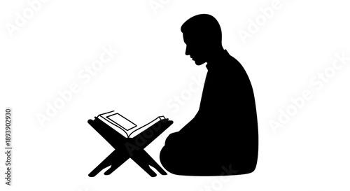 Man reading a book in a contemplative pose.