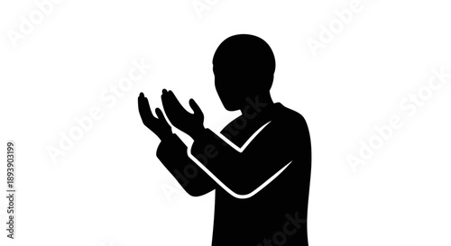 Silhouette of a person praying or meditating in a contemplative pose.