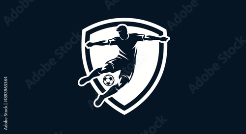 Dynamic soccer player silhouette kicking a ball within a shield emblem on a dark blue background, representing competitive spirit.