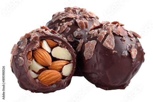 Three chocolate truffles, each covered in dark chocolate 