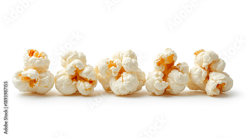 A digital photograph features five popped popcorn kernels on a white background, each with unique shapes and fluffy textures, showcasing yellow-orange centers.