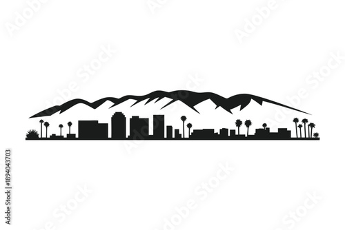 Black silhouette of a city skyline with mountainous backdrop