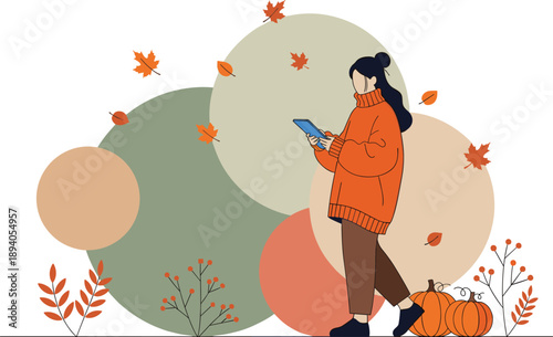 Young woman in orange sweater using digital tablet while walking through autumn landscape with falling leaves and pumpkins for seasonal technology and lifestyle branding