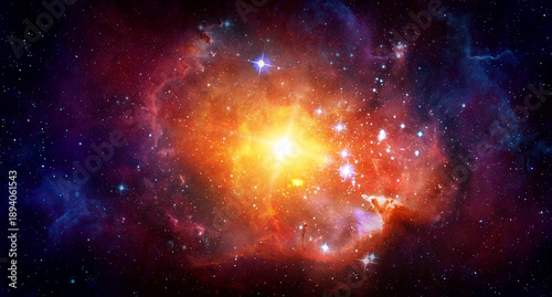 Bright cosmic nebula with a glowing stellar core surrounded by colorful interstellar clouds and distant stars. Elements of this image furnished by NASA.