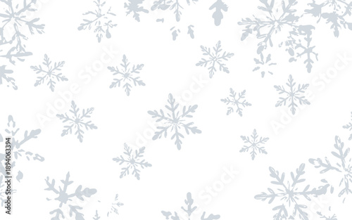 Delicate wintry snowflakes gracefully descending against a pristine white backdrop, creating a serene and festive seasonal pattern for holiday and winter-themed designs.