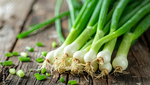 Fresh green onions on rustic wooden surface, organic and healthy vegetable, natural garden food