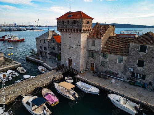  Aerial view of historic stone houses and ancient waterfront in Kastel Gomilica near Split, Croatia