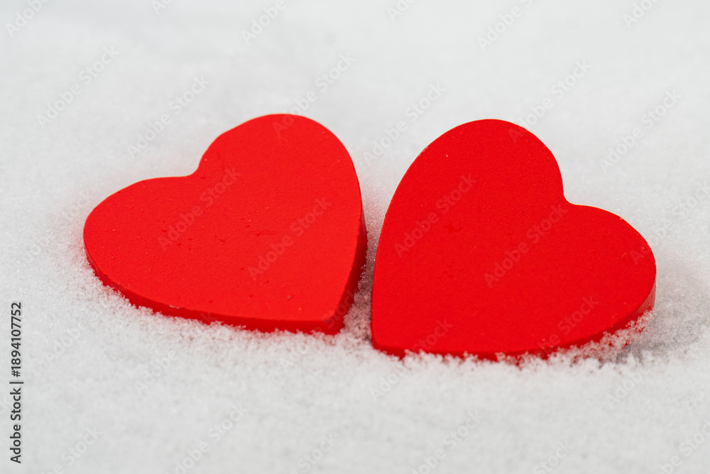 Fototapeta premium red hearts on the snow=