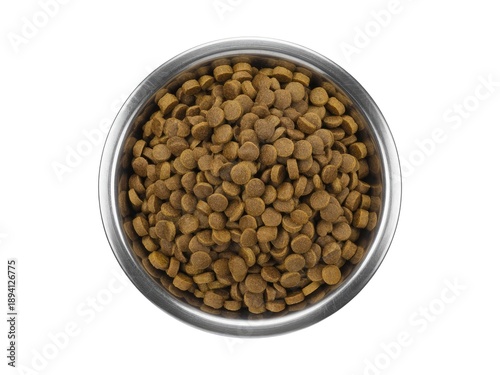 A stainless steel bowl filled with round, brown dry pet food kibble, viewed from directly above on a white background.