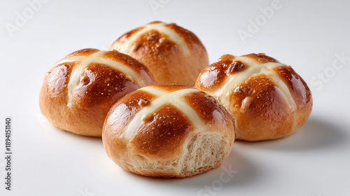 Delicious hot cross buns with a glossy finish, perfect for Easter celebrations and baking.