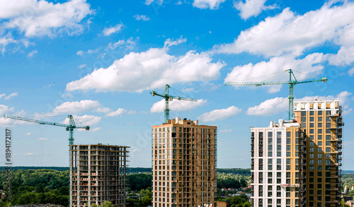 Wallpaper Mural Modern multi-storey new buildings of different colors on a background of blue sky with clouds Torontodigital.ca