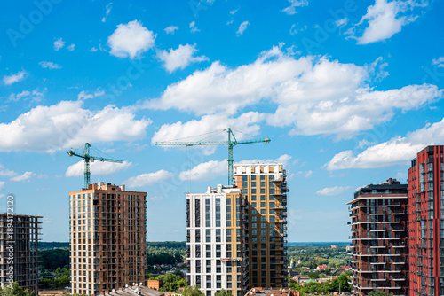 Wallpaper Mural Modern multi-storey new buildings of different colors on a background of blue sky with clouds Torontodigital.ca